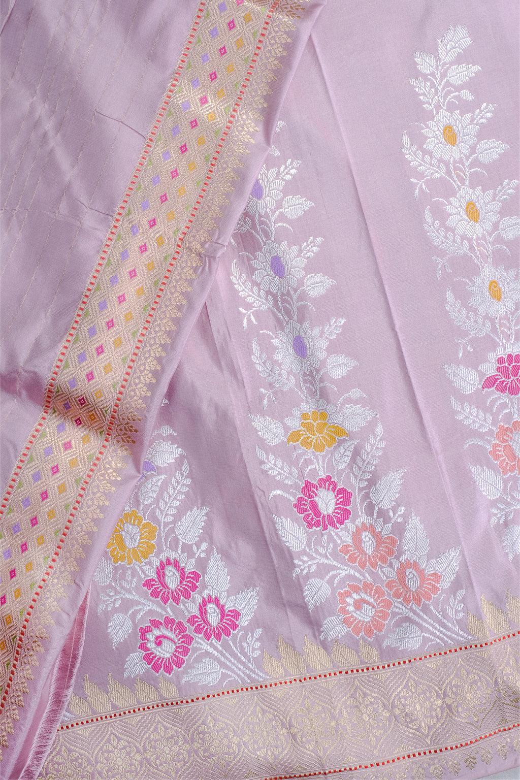 Light purple fabric with floral embroidery and decorative border